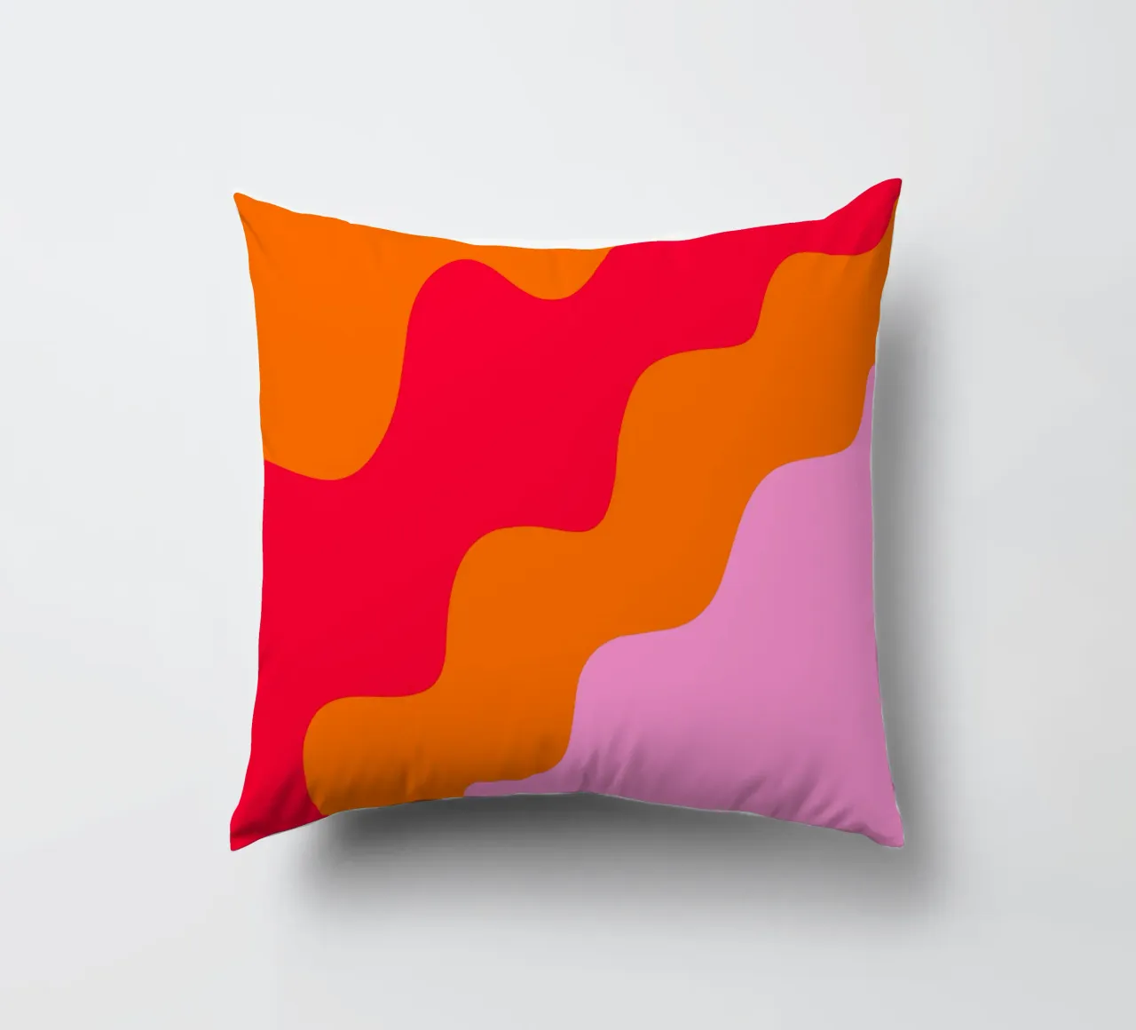Color blocking wavy shapes pink, red, orange decorative cushion by Wackapacka