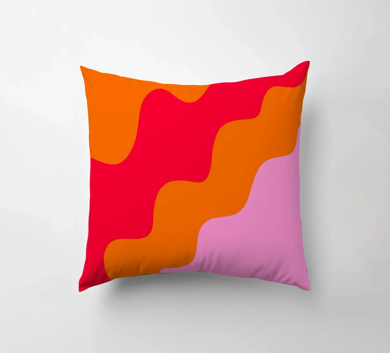 Color blocking wavy shapes pink, red, orange decorative cushion by Wackapacka