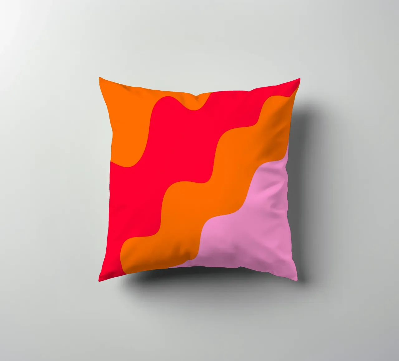 Color blocking wavy shapes pink, red, orange decorative cushion by Wackapacka