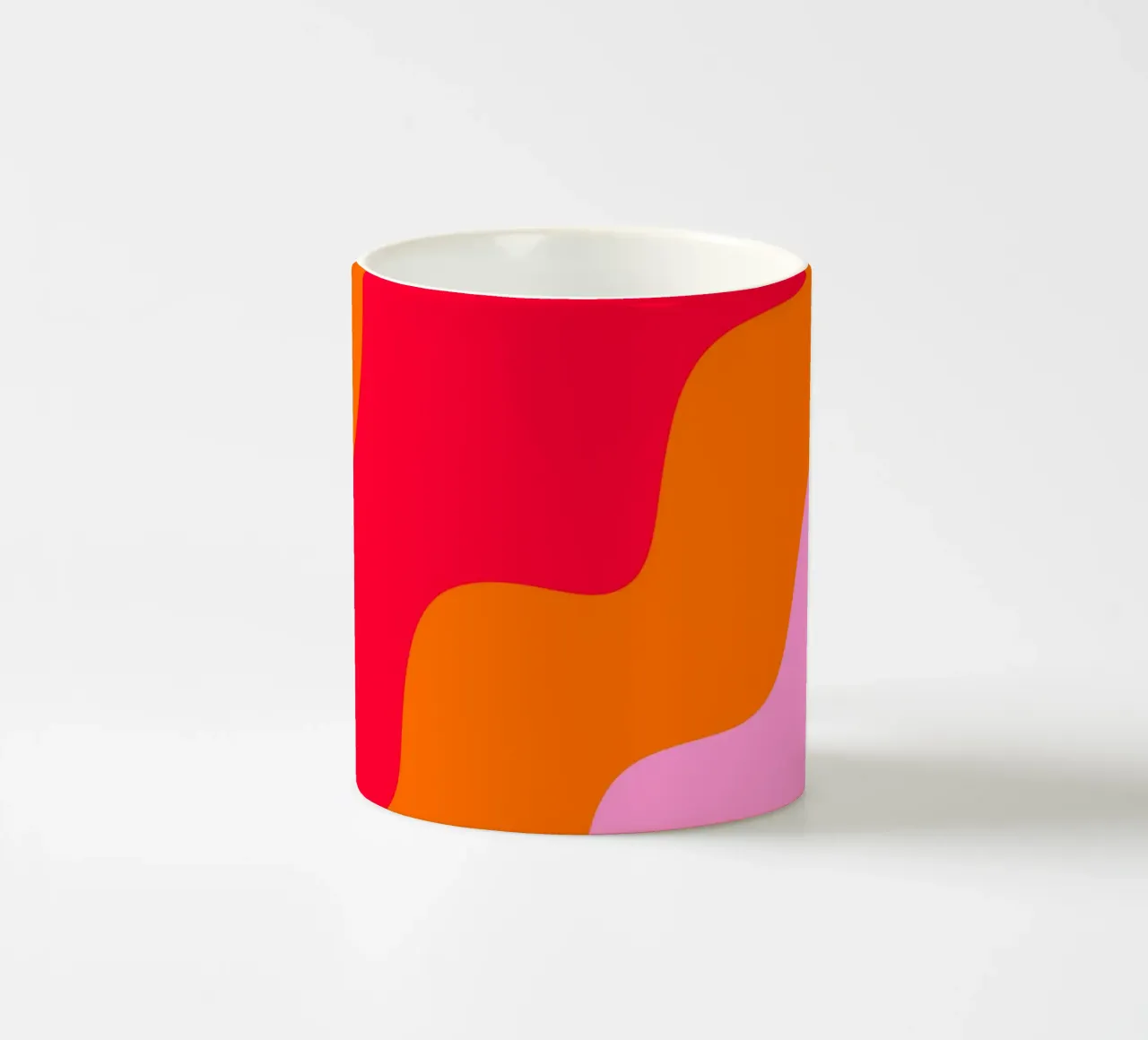 Color blocking wavy shapes pink, red, orange ceramic mug by Wackapacka