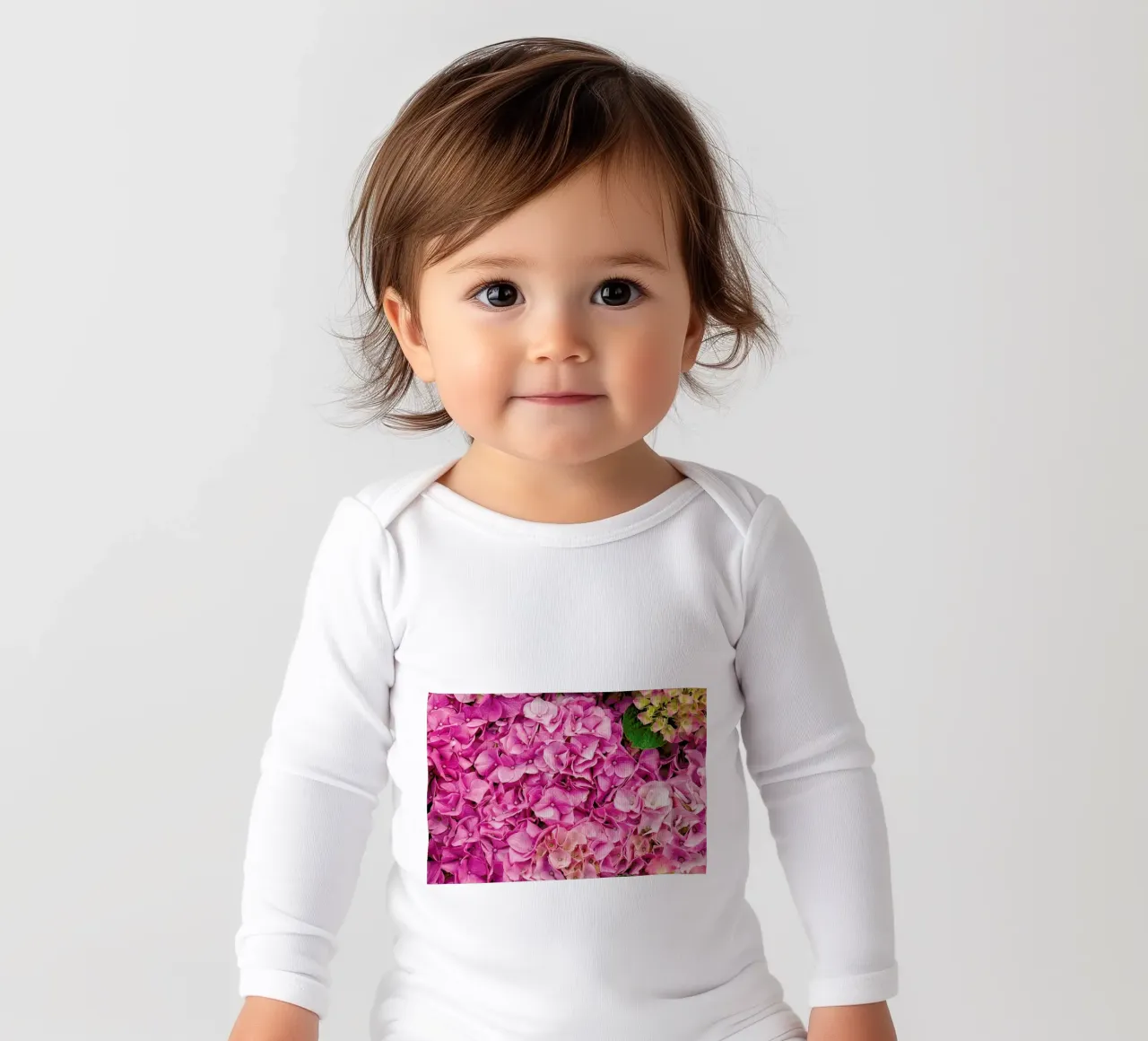 Hortensia Pink long-sleeve baby romper by Curious Collections by Marielle Leenders
