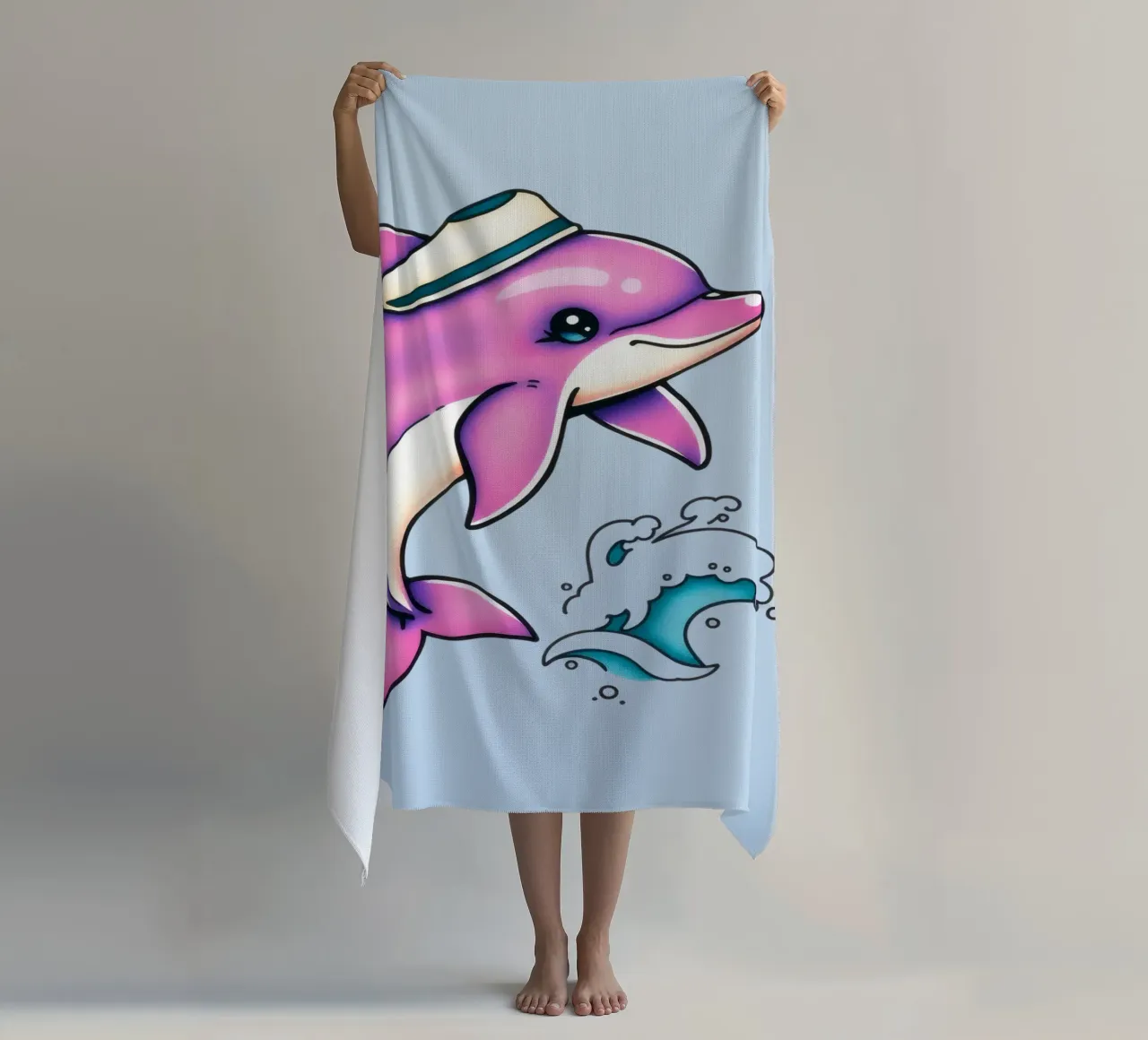 Playful pink dolphin wearing a hat jumps through waves beach towel by DesignDoodle