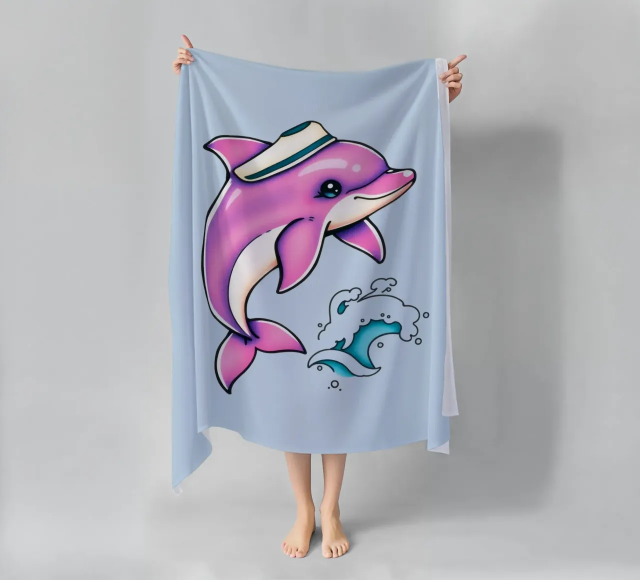 Playful pink dolphin wearing a hat jumps through waves beach towel by DesignDoodle