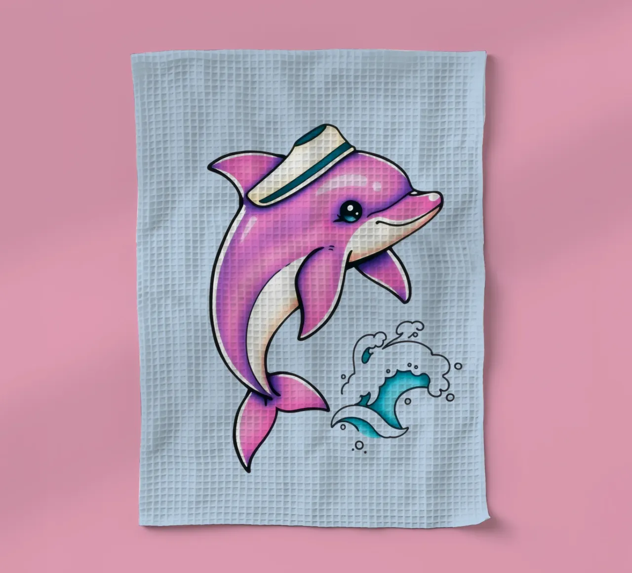 Un dauphin rose enjoué portant un chapeau saute dans les vagues torchon de DesignDoodle
