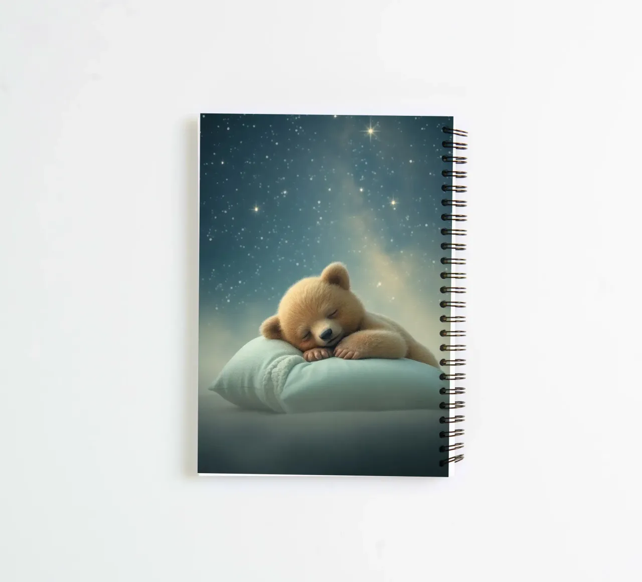 Cute bear cub sleeping peacefully on a fluffy pillow spiral notebook by DesignDoodle