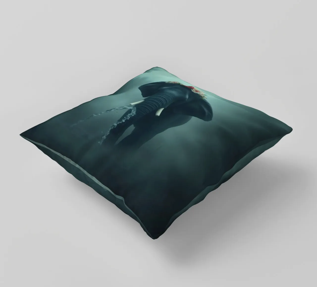 Elephant adorned with flowers displaying beauty in a misty decorative cushion by DesignDoodle