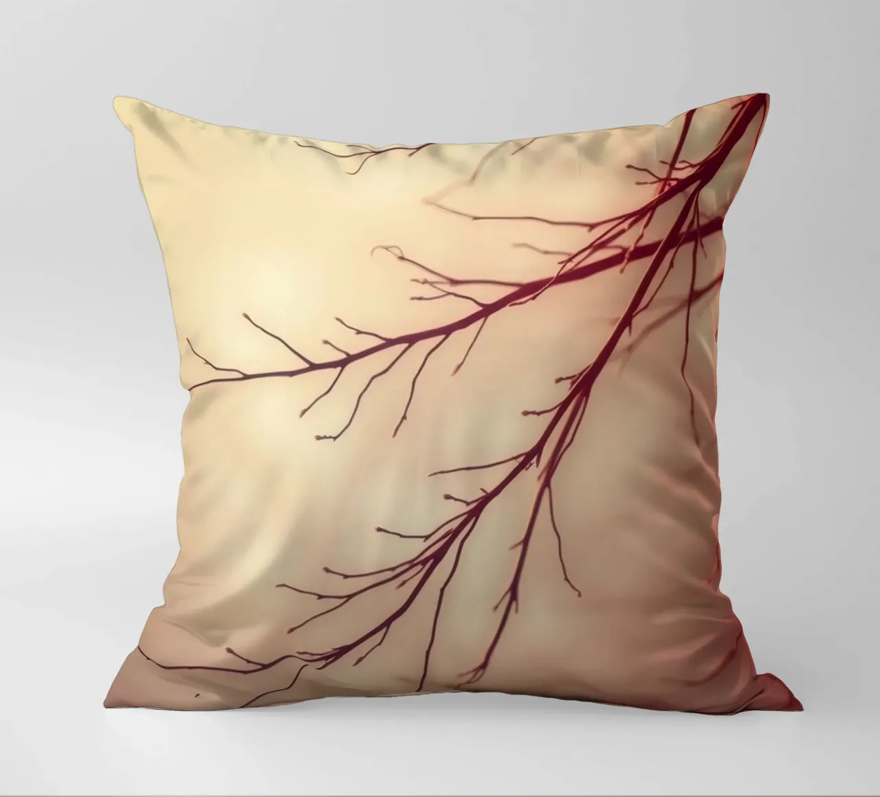 a softly blurred background with graceful tree branches decorative cushion by DesignDoodle