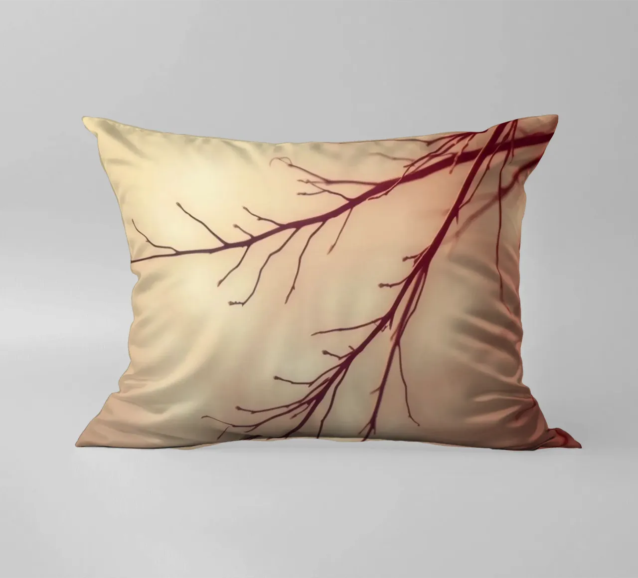 a softly blurred background with graceful tree branches decorative cushion by DesignDoodle