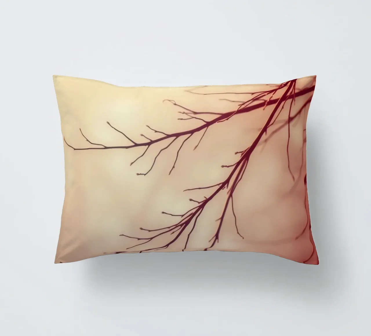 a softly blurred background with graceful tree branches decorative cushion by DesignDoodle