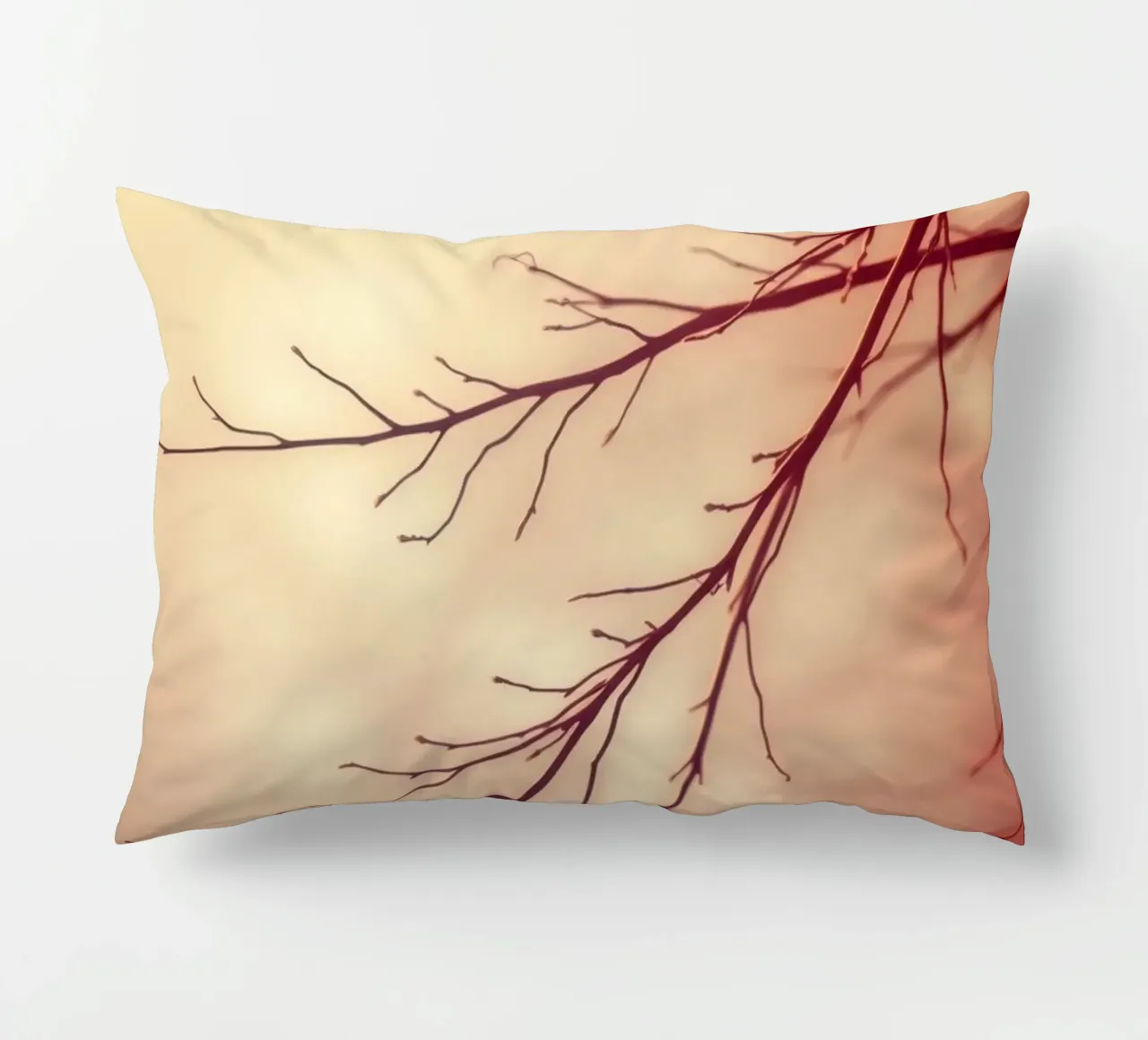 a softly blurred background with graceful tree branches decorative cushion by DesignDoodle