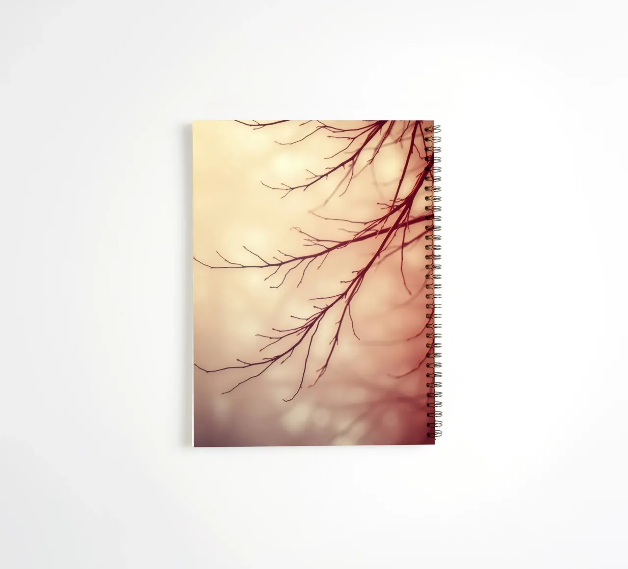 a softly blurred background with graceful tree branches spiral notebook by DesignDoodle