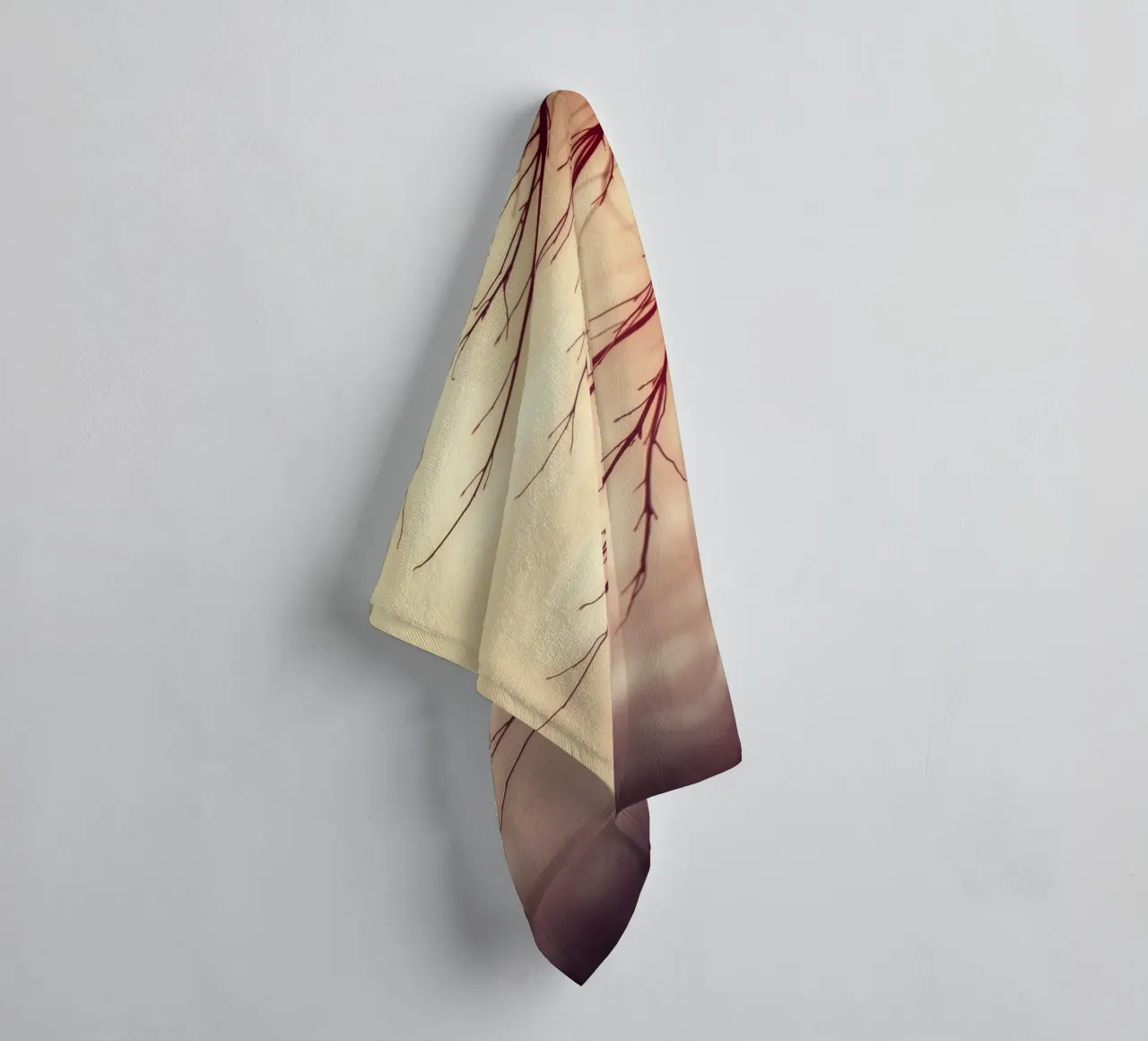a softly blurred background with graceful tree branches towel by DesignDoodle