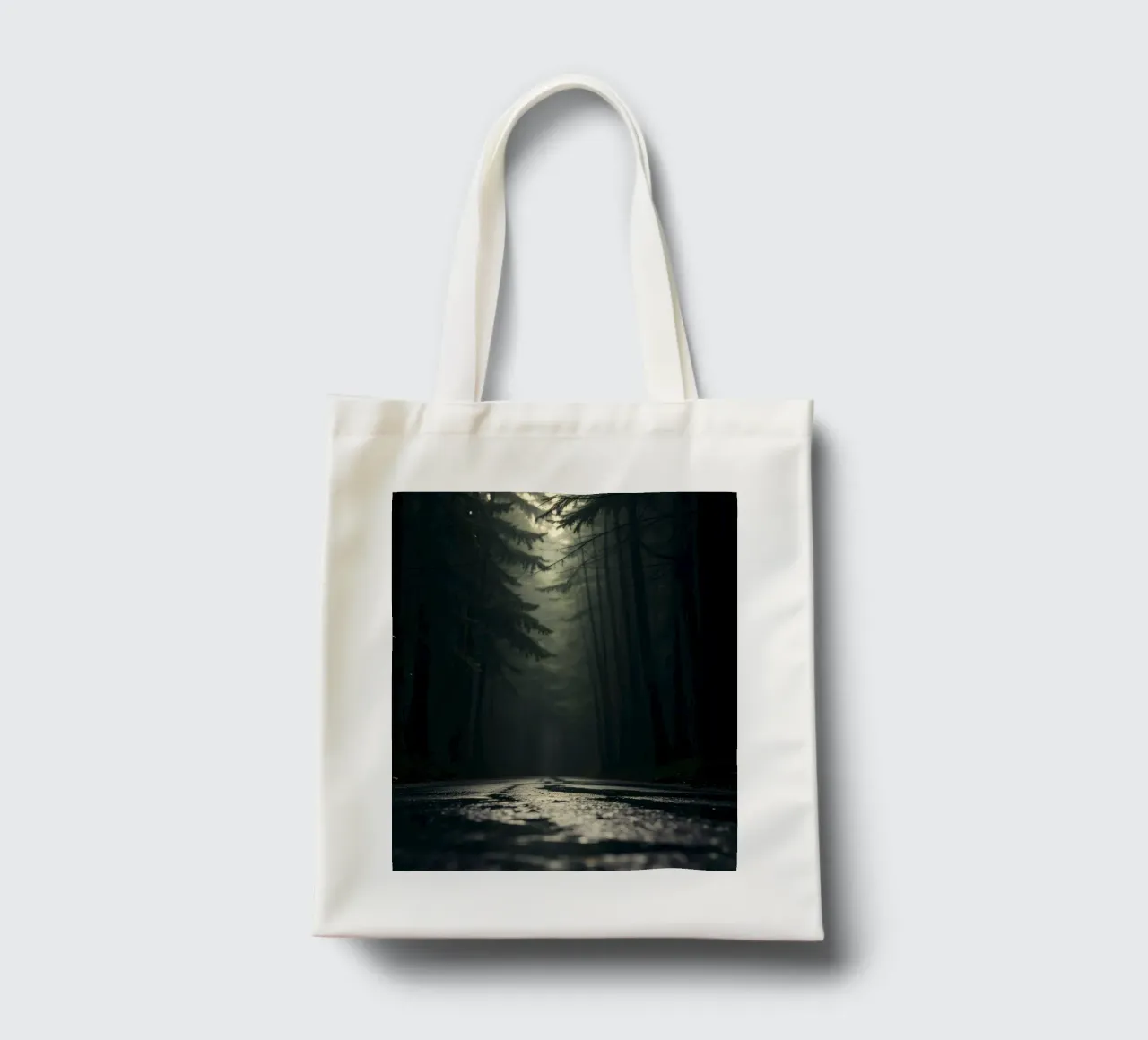 Misty forest path with soft light filters through tall trees tote bag by DesignDoodle