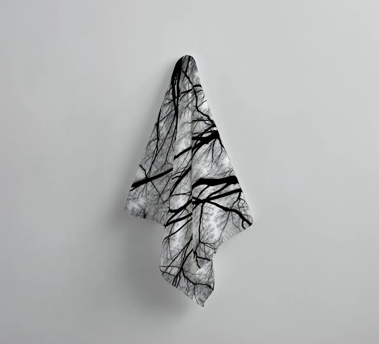Lifeless branches stretch against a cloudy sky towel by DesignDoodle
