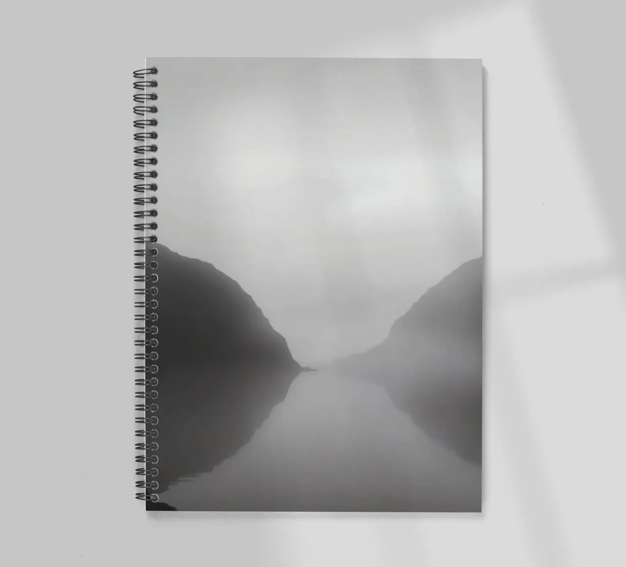 Misty mountain landscape with calm waters reflecting spiral notebook by DesignDoodle