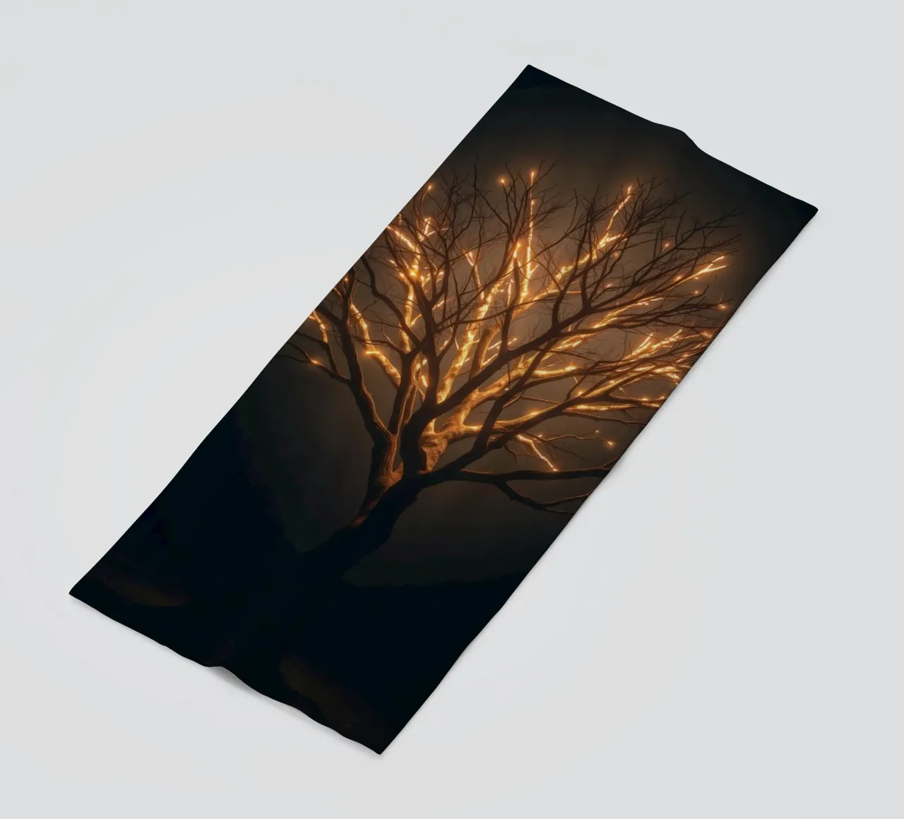 Brightly lit tree branches create a captivating abstract beach towel by DesignDoodle