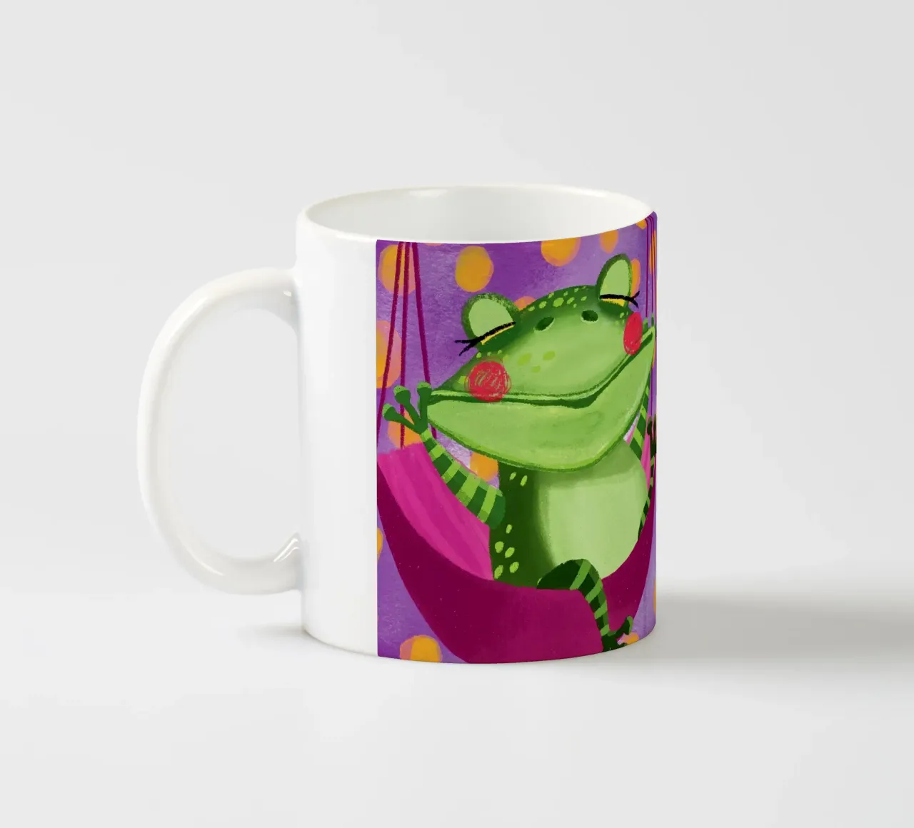 Una rana divertente si dondola sull'amaca tazza in ceramica da Honigbrombeere