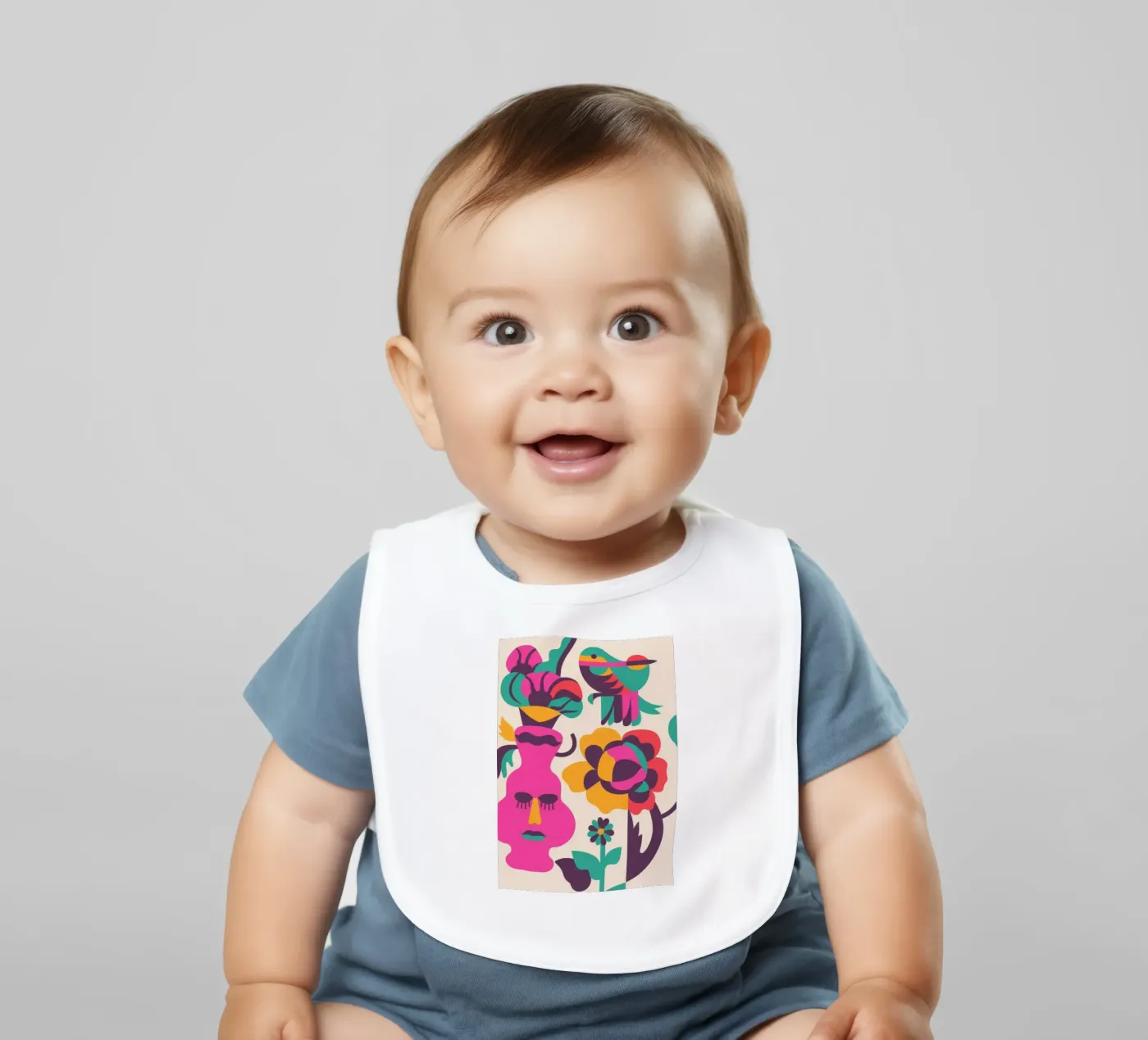 Faces and Birds baby bib by Seren Liodra