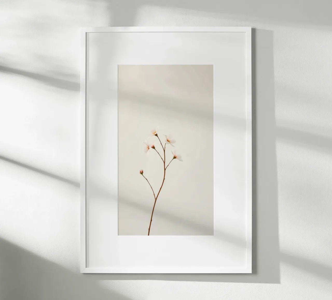 Zarter Blumenzweig vor einem weichen, neutralen Hintergrund Poster mit Holzrahmen von DesignDoodle