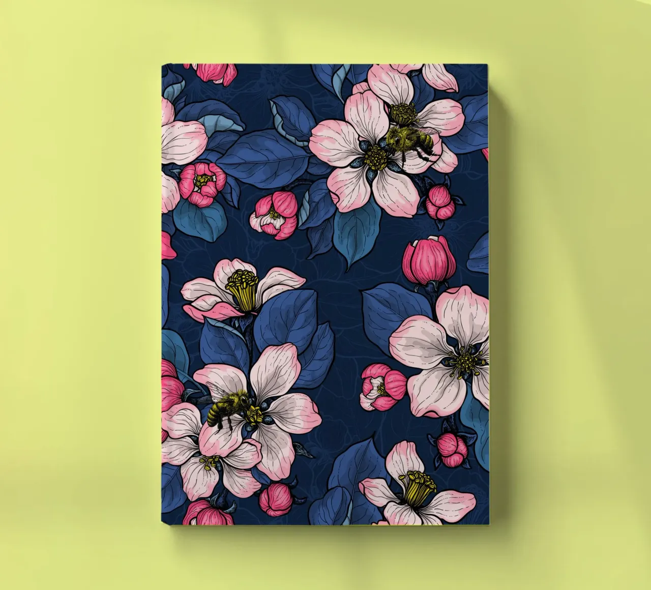 Apple blossom on dark blue notebook by Painted Nature