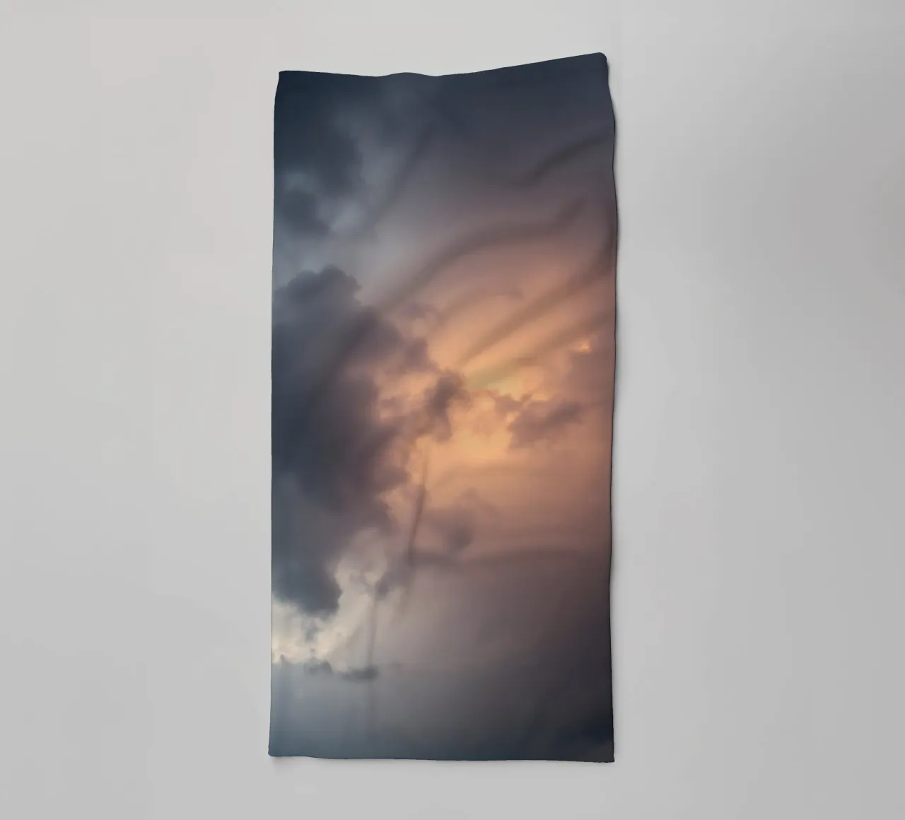 Soft hues of twilight emerge through clouds towel by DesignDoodle