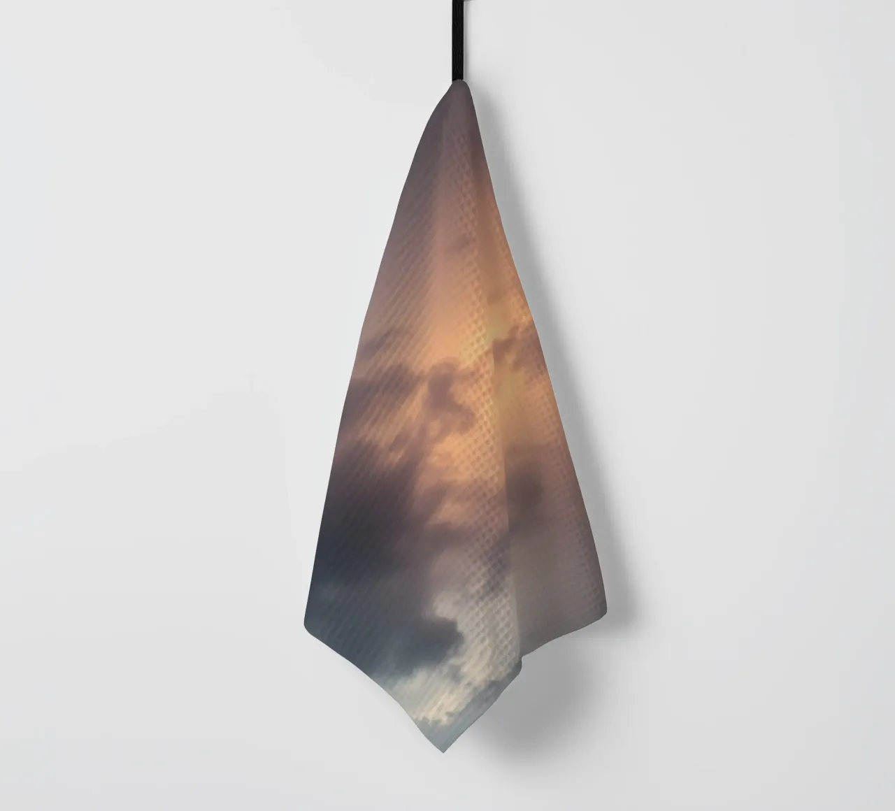 Soft hues of twilight emerge through clouds tea towel by DesignDoodle