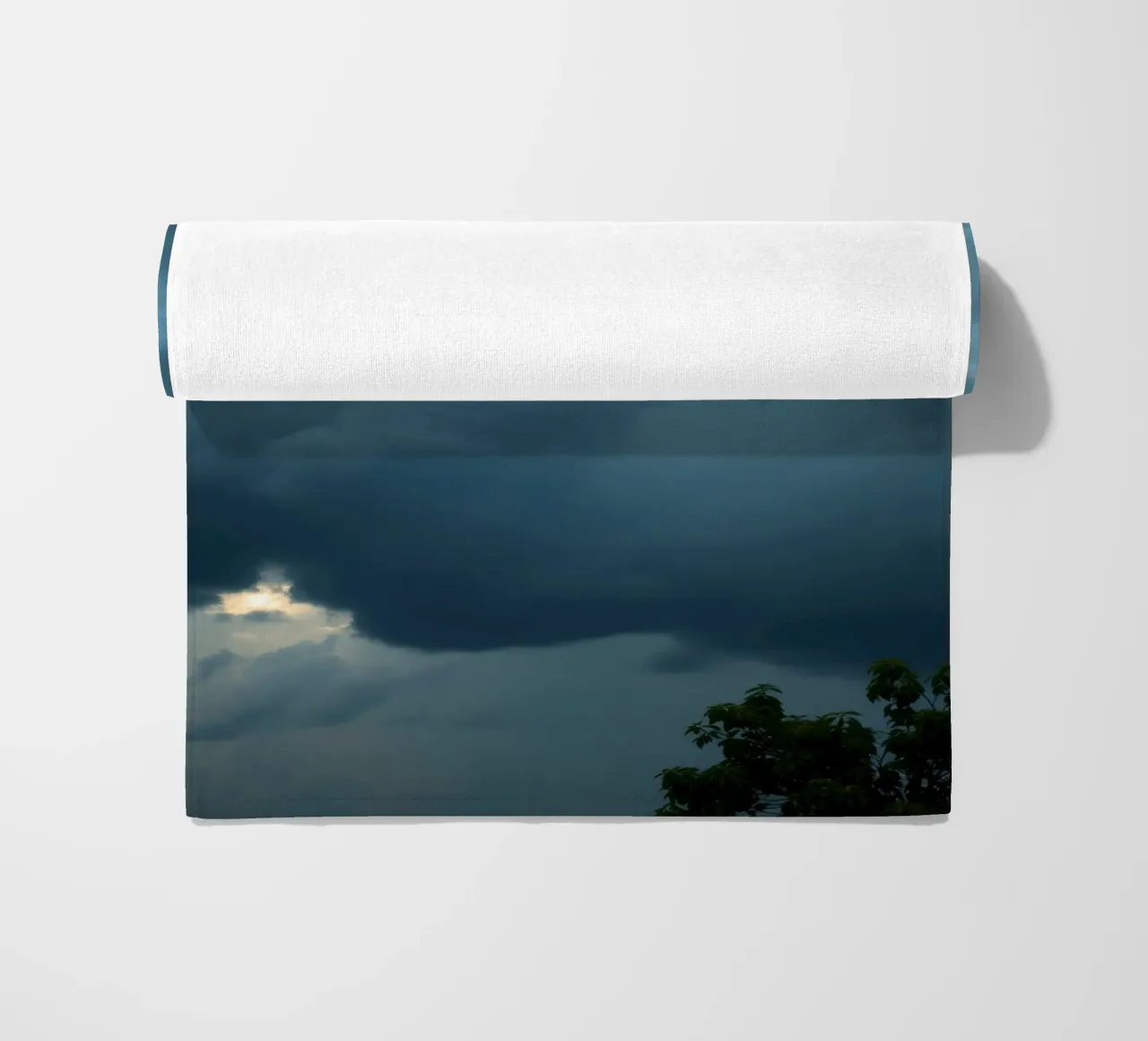 Dark and moody clouds gathering in the dramatic sky beach towel by DesignDoodle