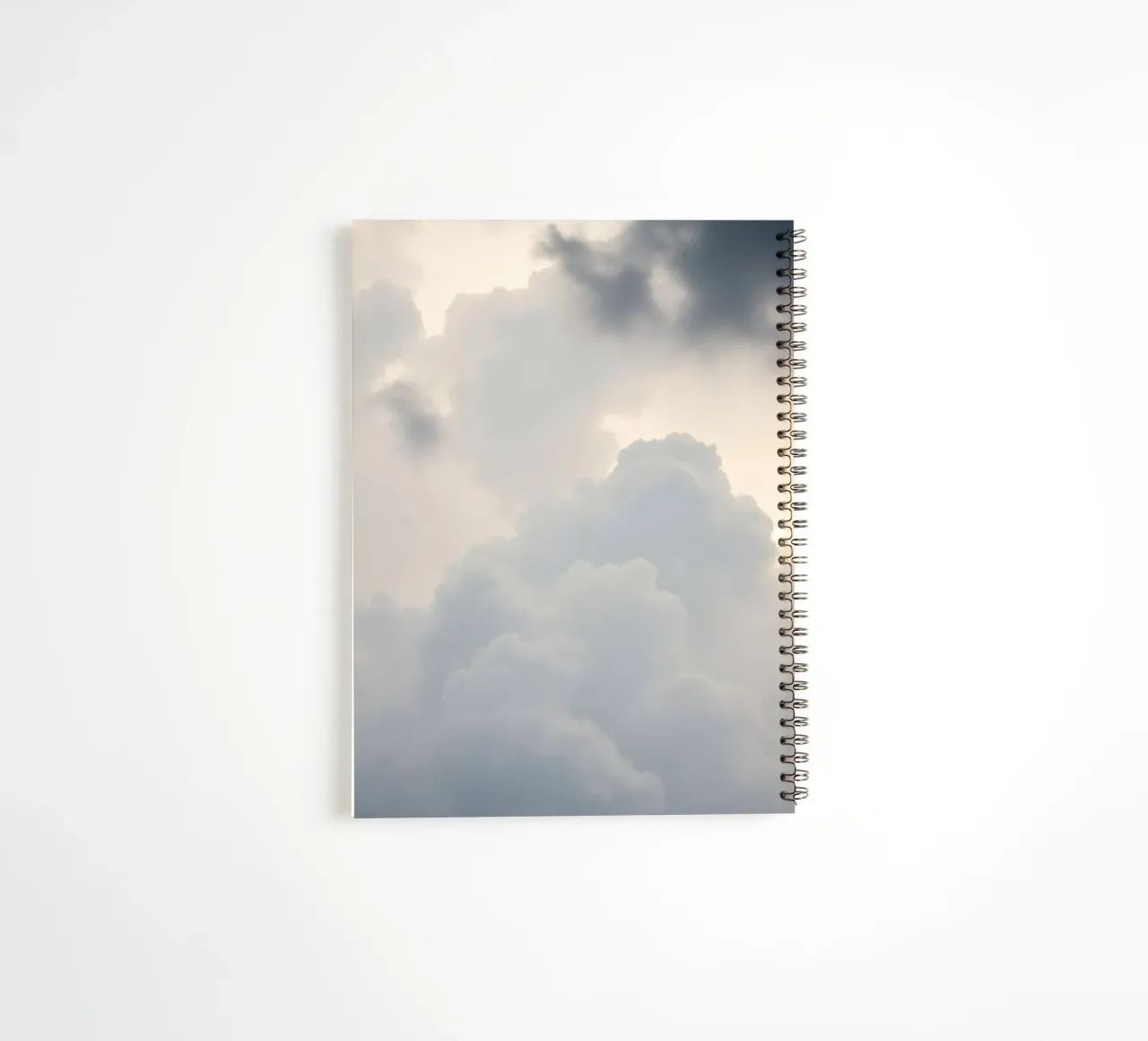 Sky filled with soft clouds and light hues a calm and sooth spiral notebook by DesignDoodle