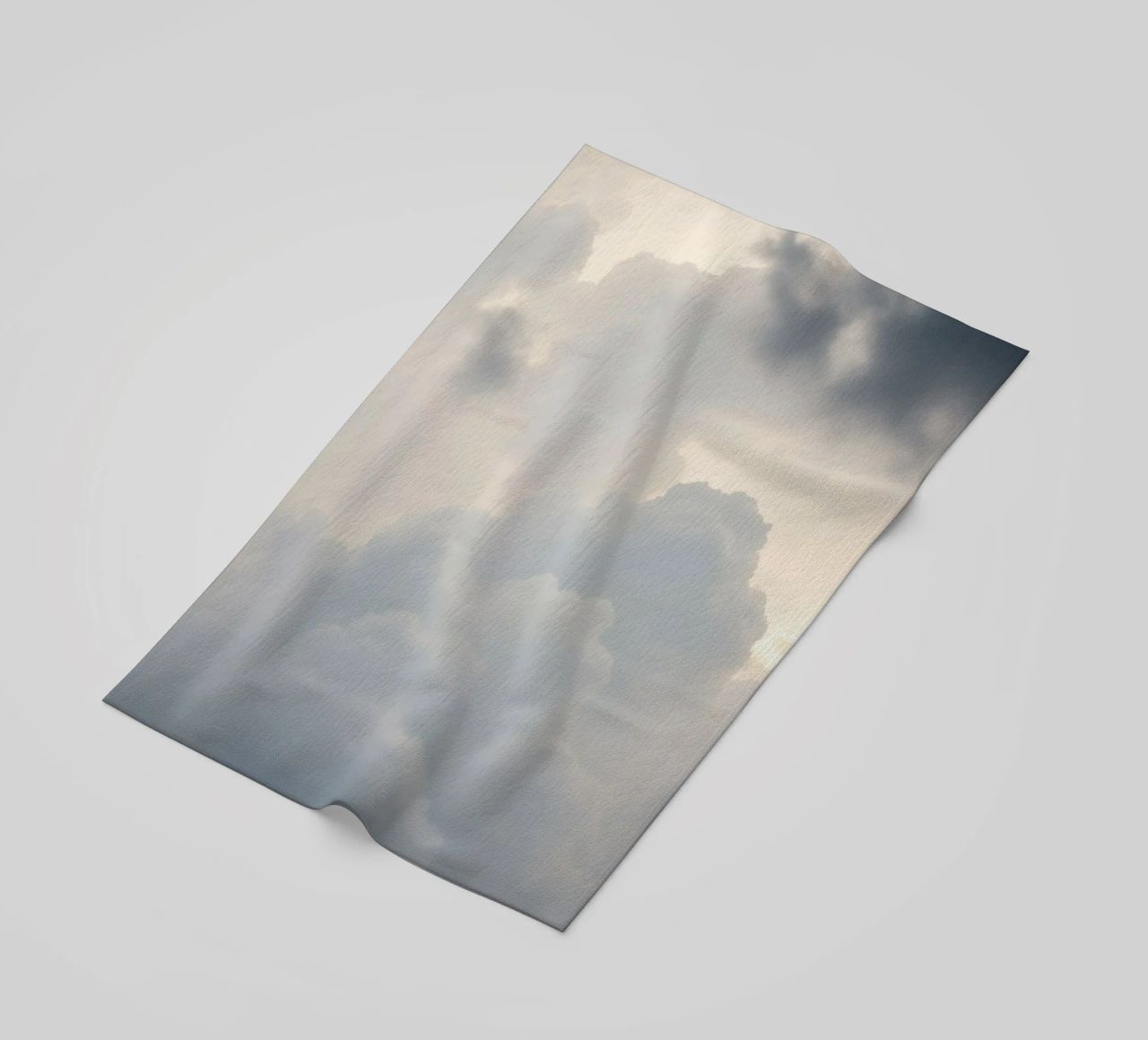 Sky filled with soft clouds and light hues a calm and sooth beach towel by DesignDoodle