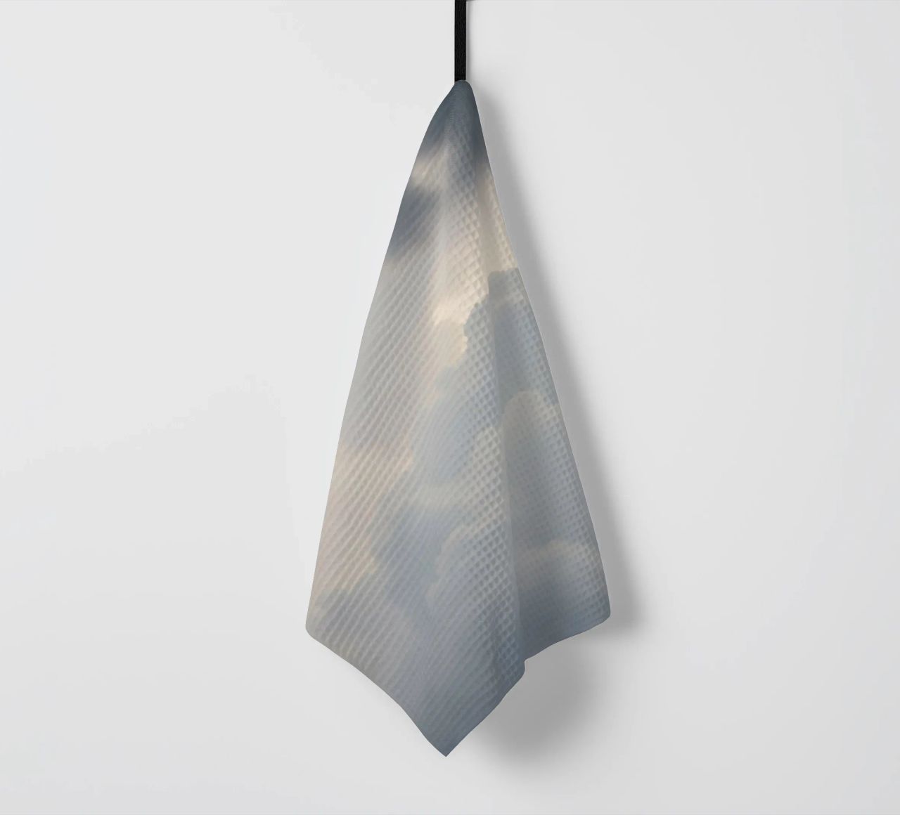 Sky filled with soft clouds and light hues a calm and sooth tea towel by DesignDoodle