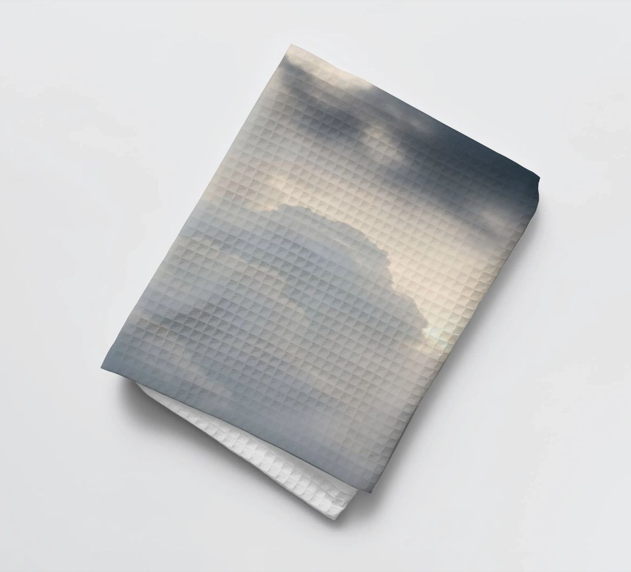 Sky filled with soft clouds and light hues a calm and sooth tea towel by DesignDoodle