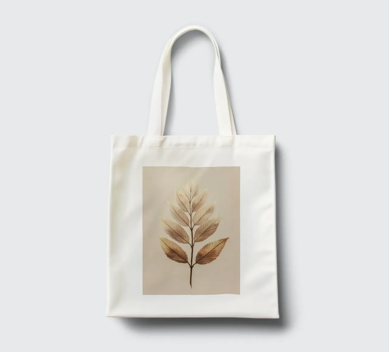 Plant leaves on a beige branch tote bag by Carinaprint