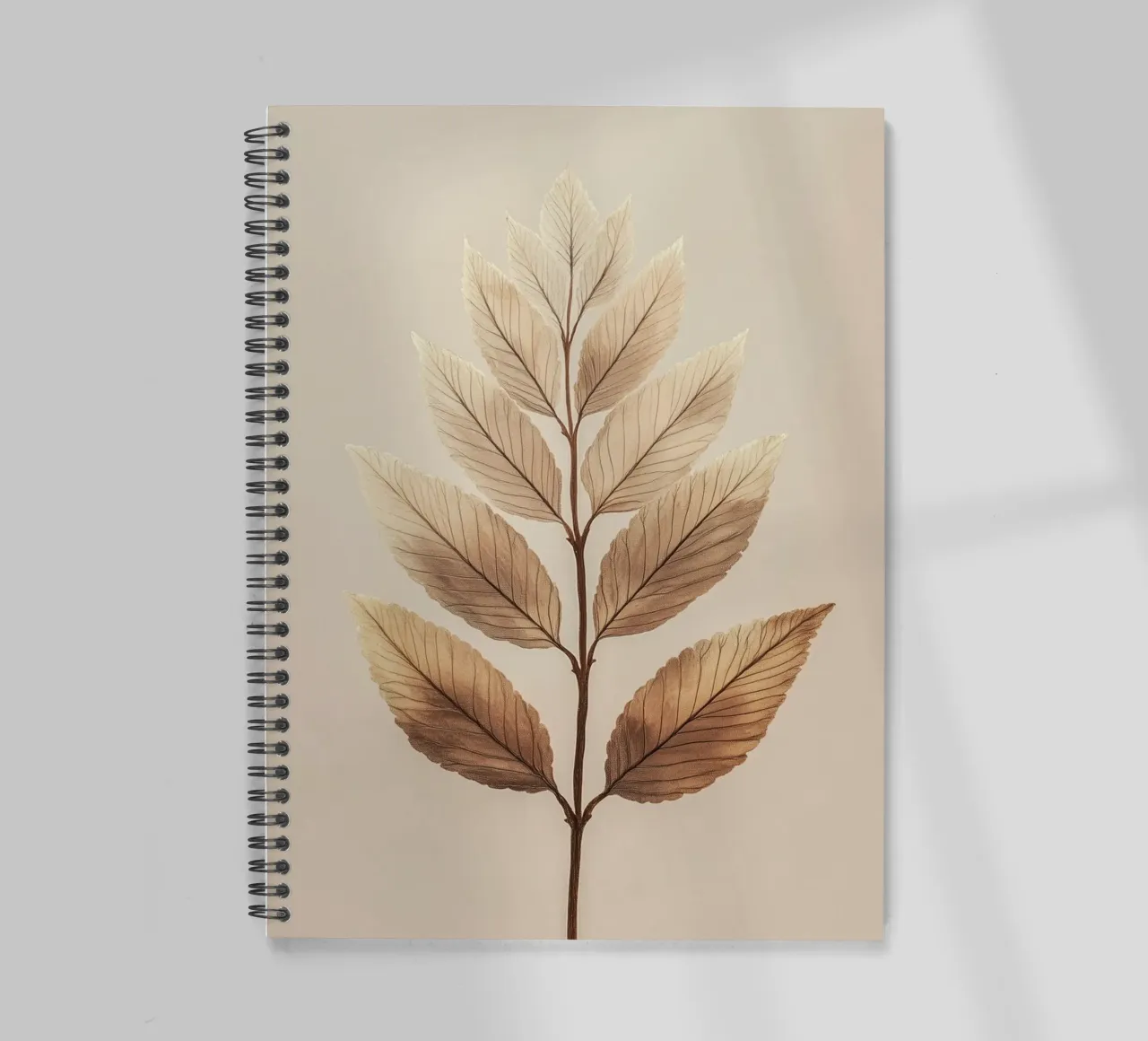 Plant leaves on a beige branch spiral notebook by Carinaprint