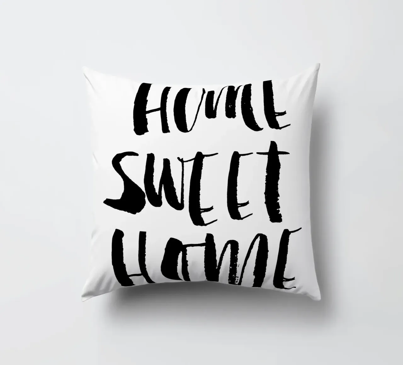 Home Sweet Home Design tipografico in bianco e nero cuscino da THE MOTIVATED TYPE
