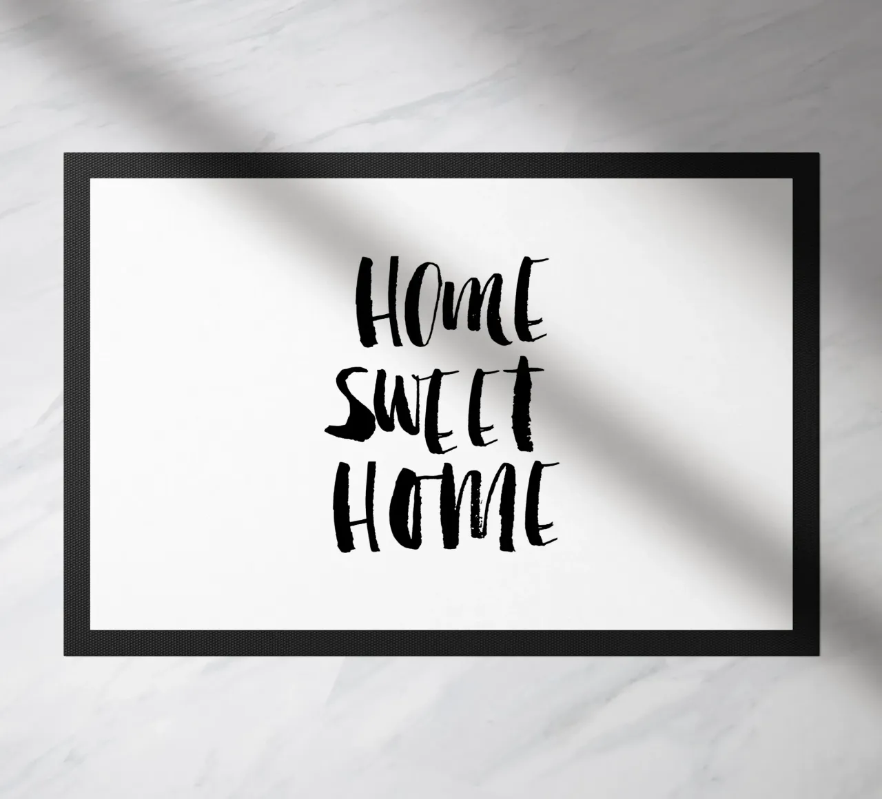 Home Sweet Home Design tipografico in bianco e nero zerbino da THE MOTIVATED TYPE