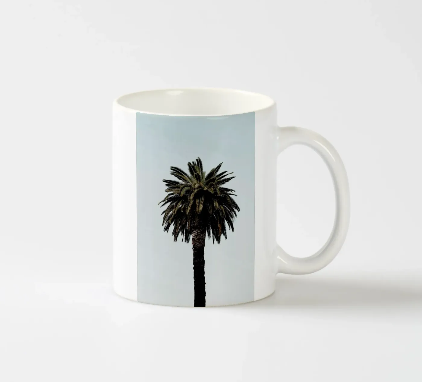 Palmtree ceramic mug by Laura Palm