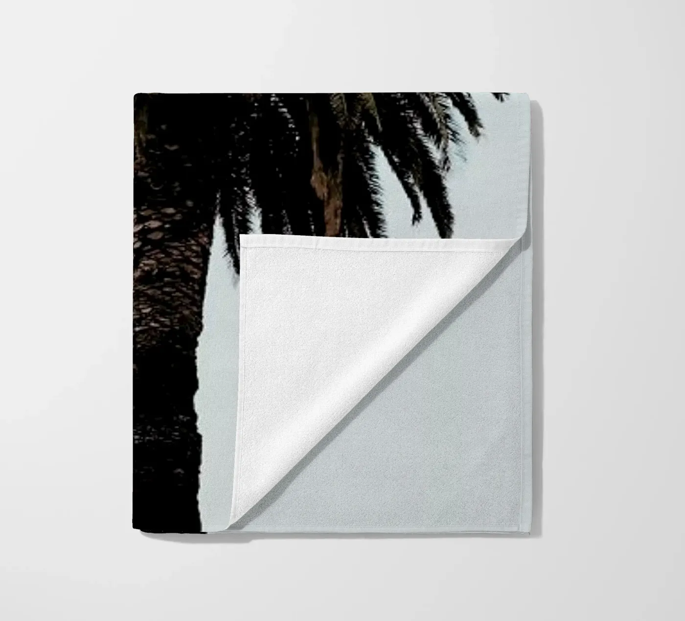 Palmtree beach towel by Laura Palm