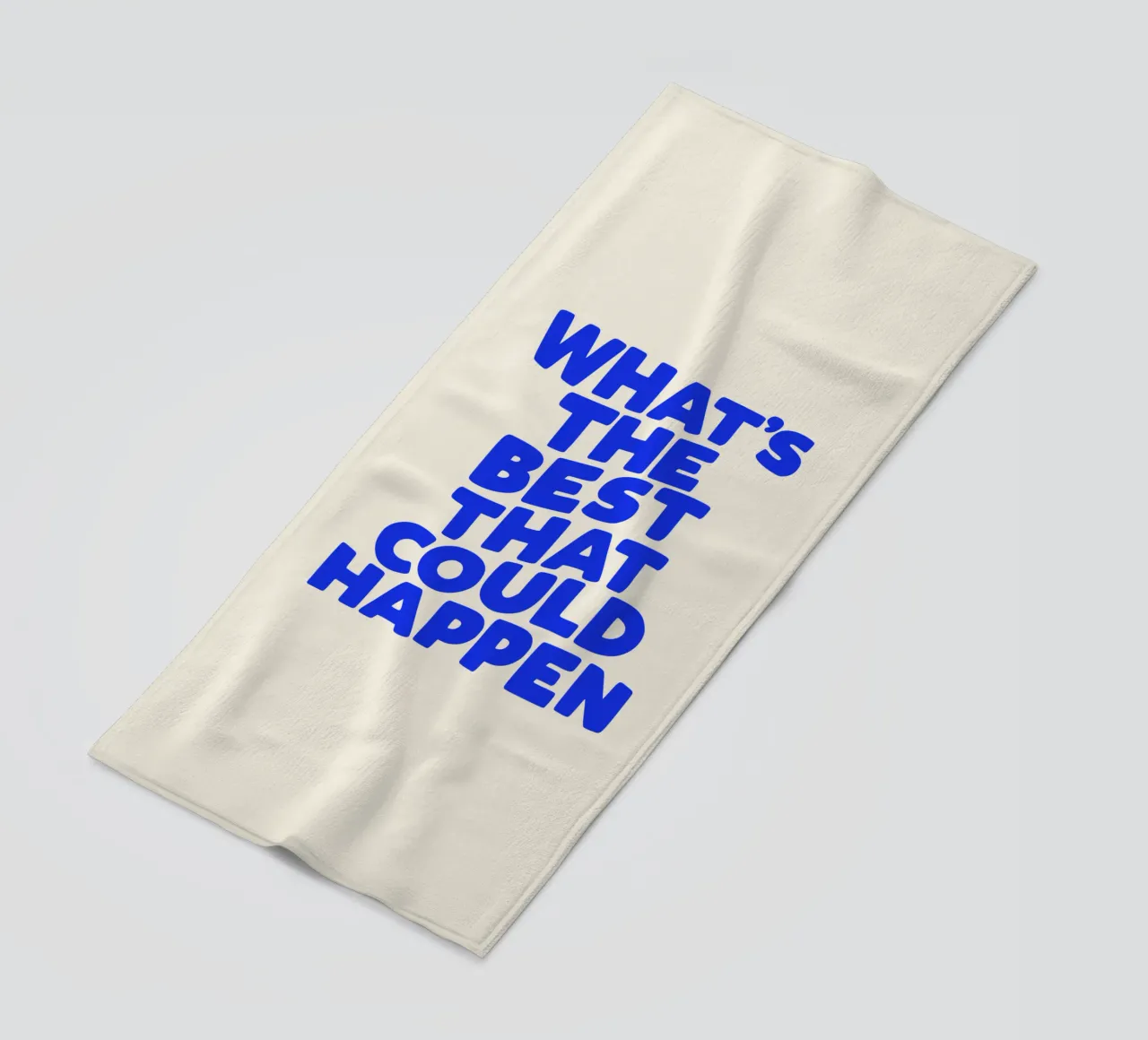 Le meilleur qui puisse arriver Citation optimiste en bleu serviette de plage de THE MOTIVATED TYPE