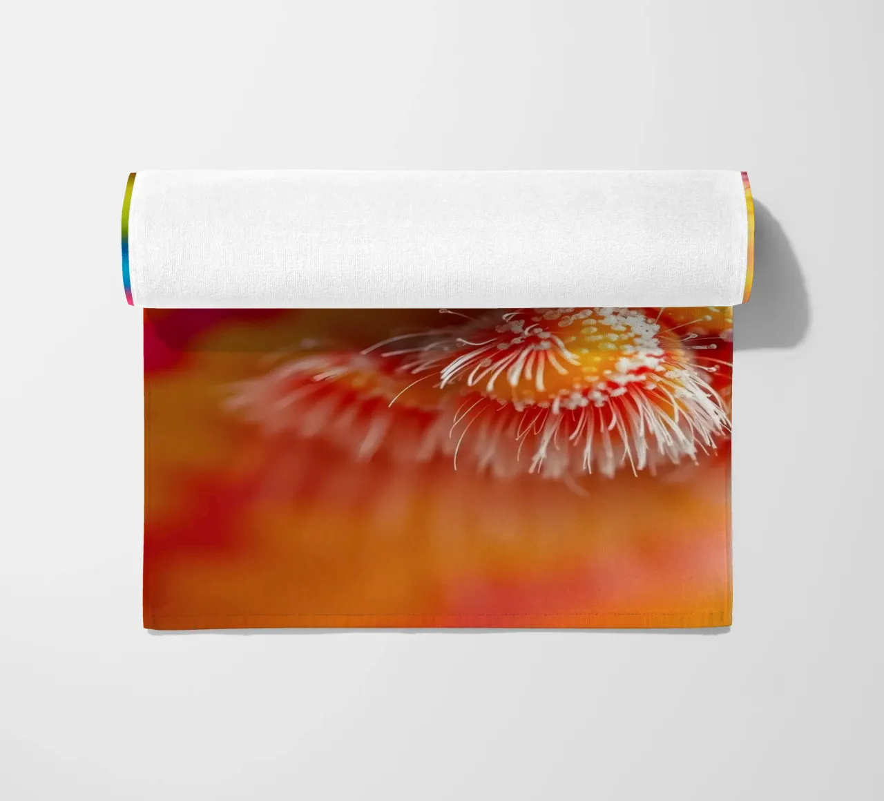 close-up of an abstract creature featuring colorful patterns beach towel by DesignDoodle