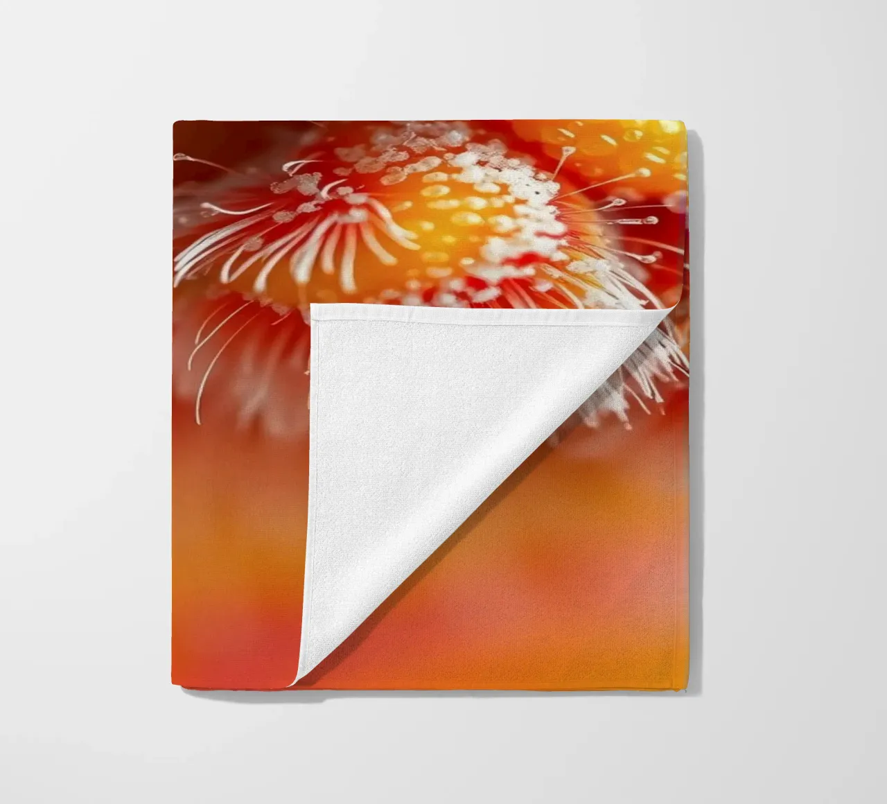 close-up of an abstract creature featuring colorful patterns beach towel by DesignDoodle