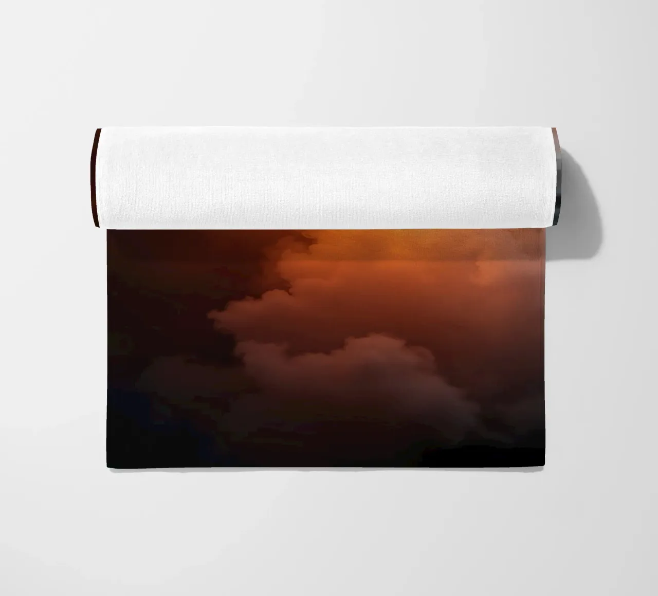 clouds with warm orange glow create a captivating background beach towel by DesignDoodle