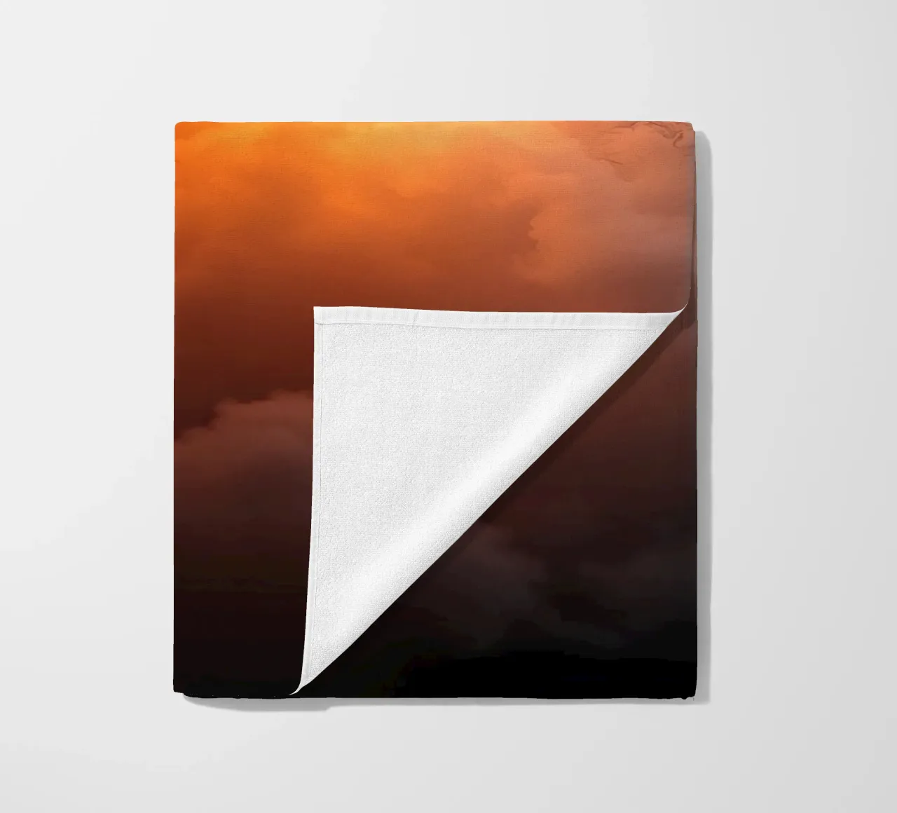 clouds with warm orange glow create a captivating background beach towel by DesignDoodle