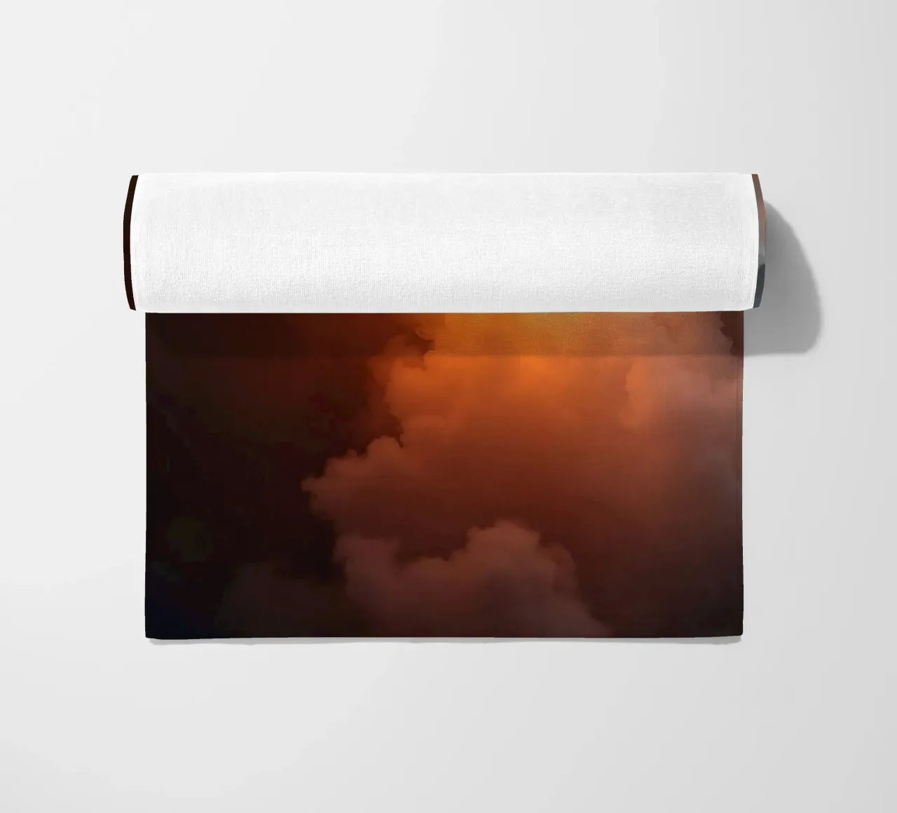 clouds with warm orange glow create a captivating background beach towel by DesignDoodle