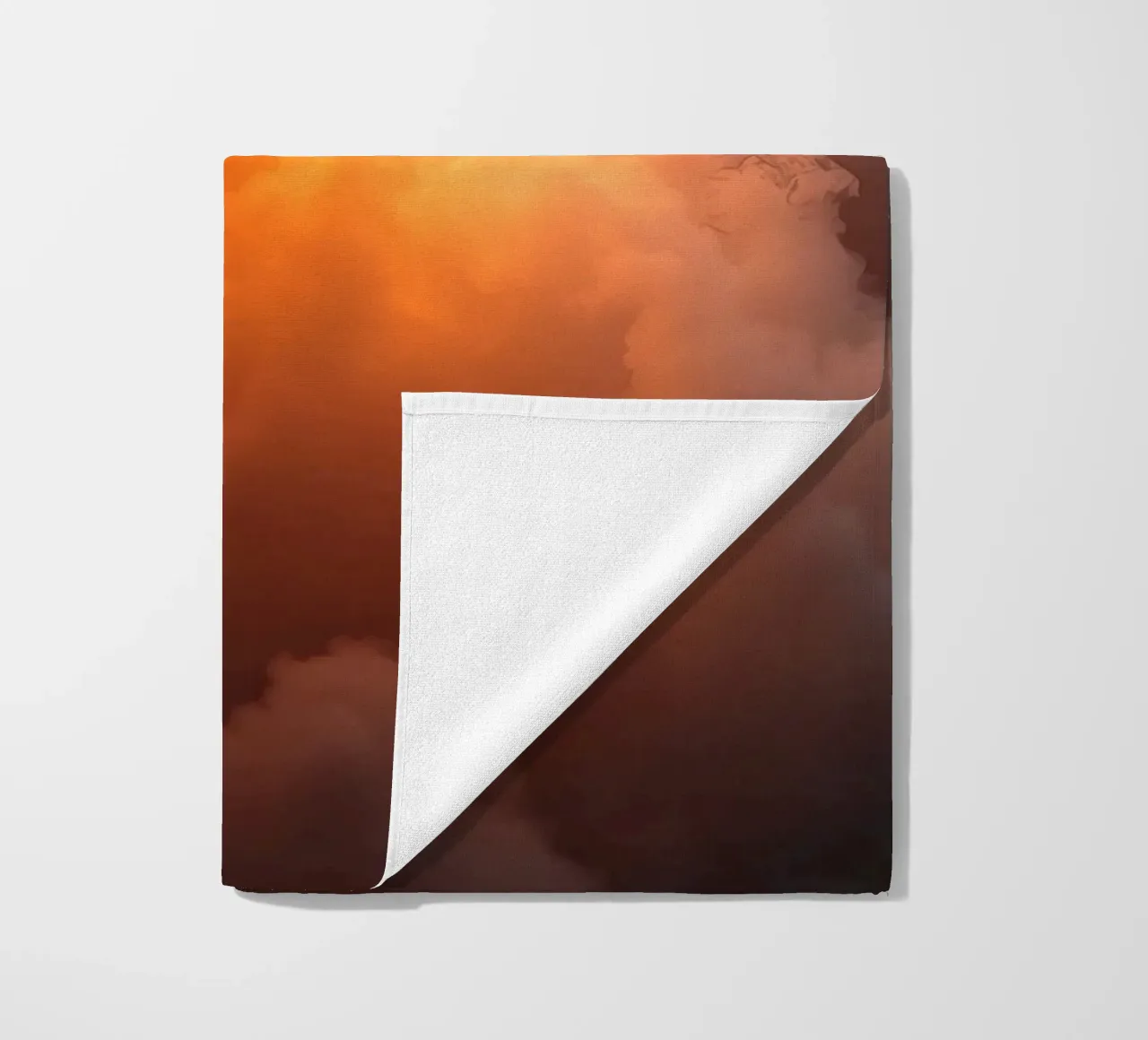clouds with warm orange glow create a captivating background beach towel by DesignDoodle
