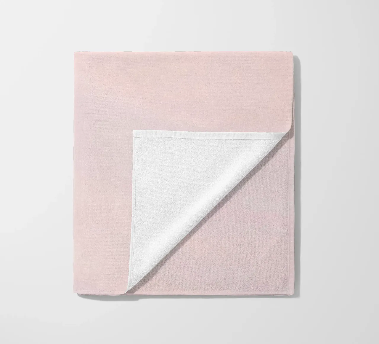 Soft pastel pink with gentle and smooth textures beach towel by DesignDoodle