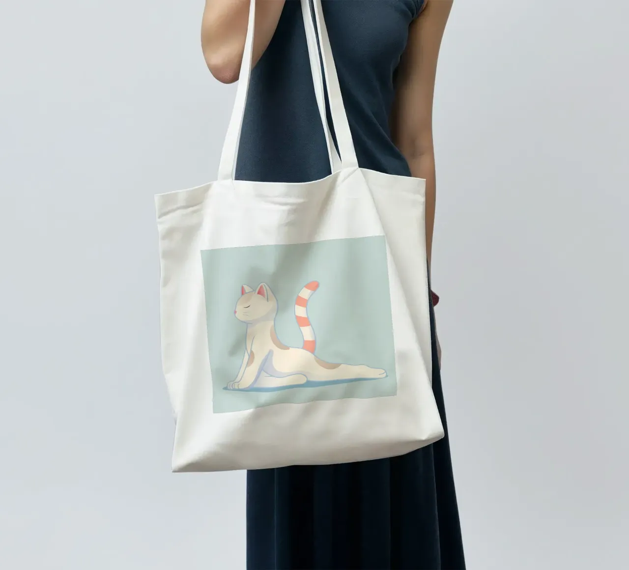 Cat in a gentle yoga pose tote bag by namosh