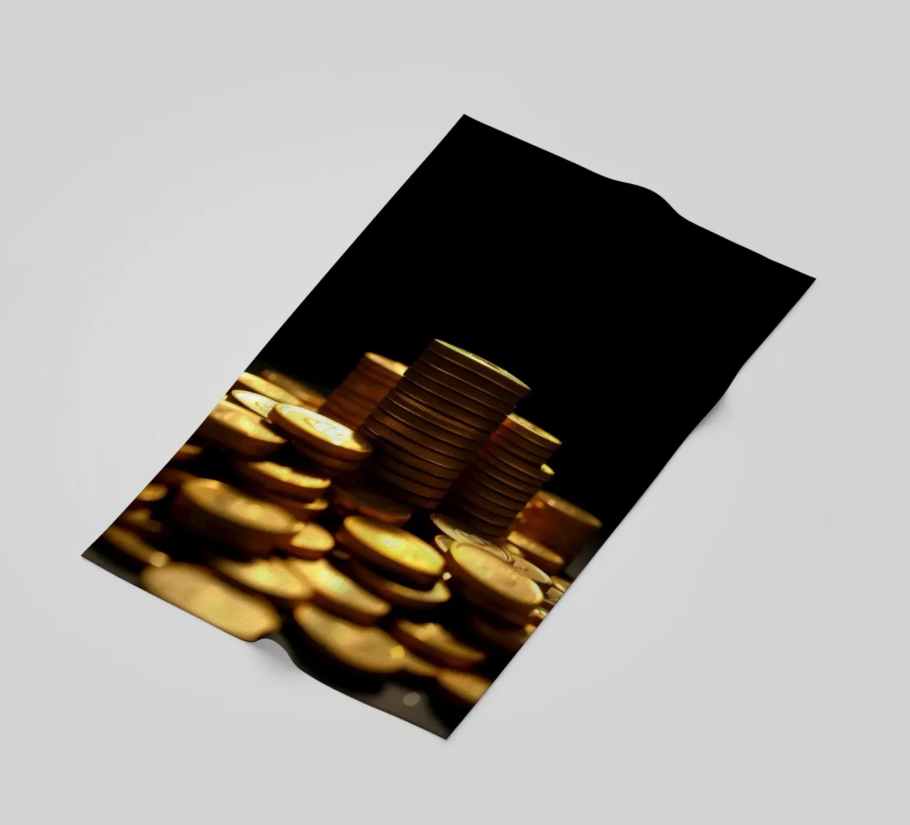 Stacks of shiny coins create a dramatic display beach towel by DesignDoodle