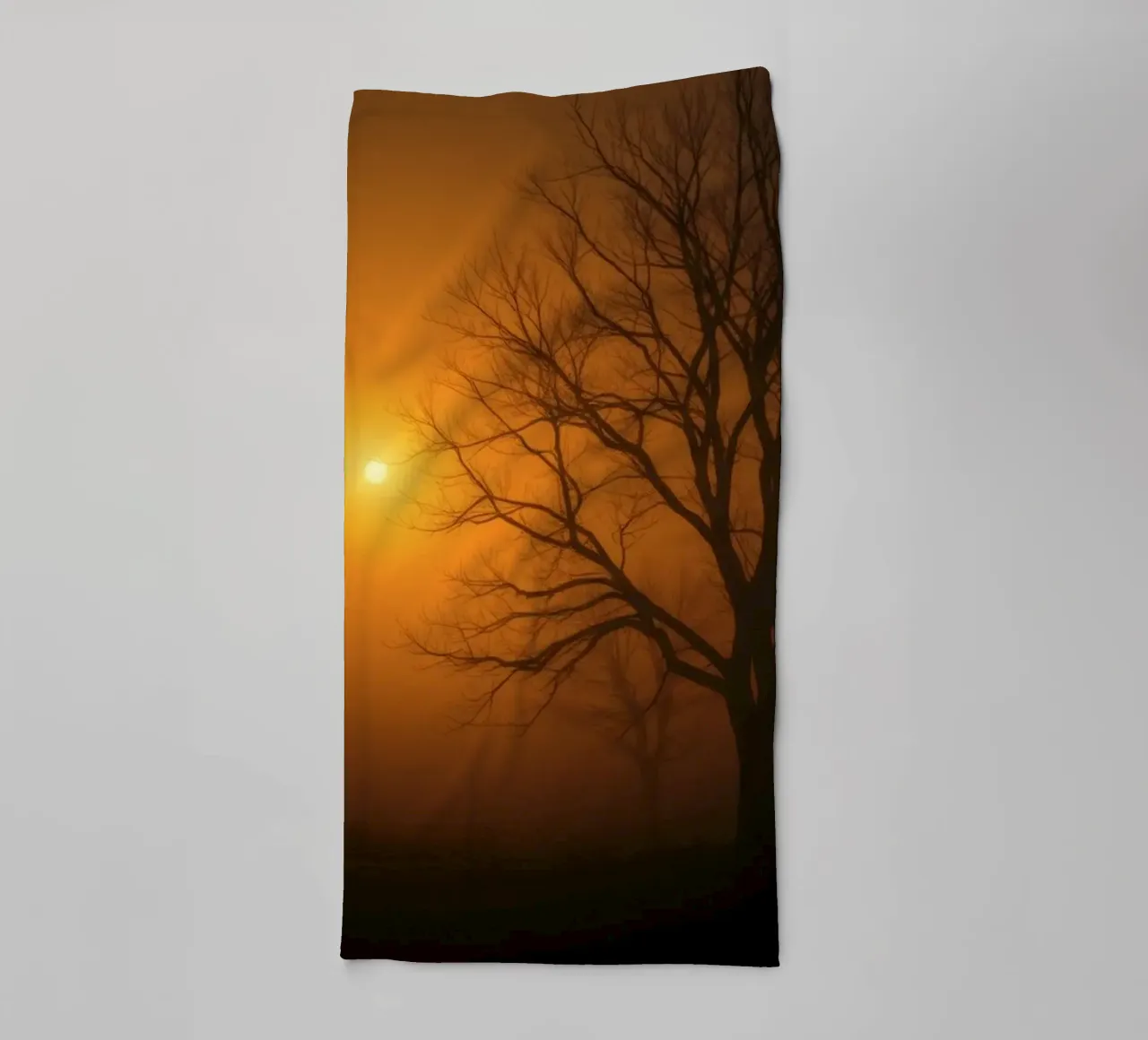 Mysterious twilight envelops a foggy landscape with silhouet towel by DesignDoodle