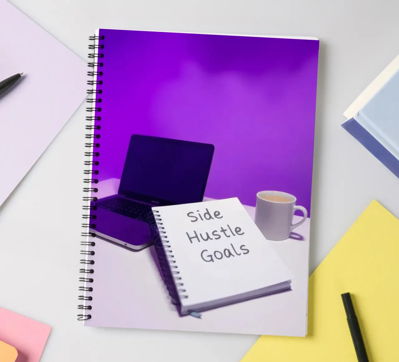 Setting side hustle goals with a laptop and coffee in a cozy spiral notebook by DesignDoodle