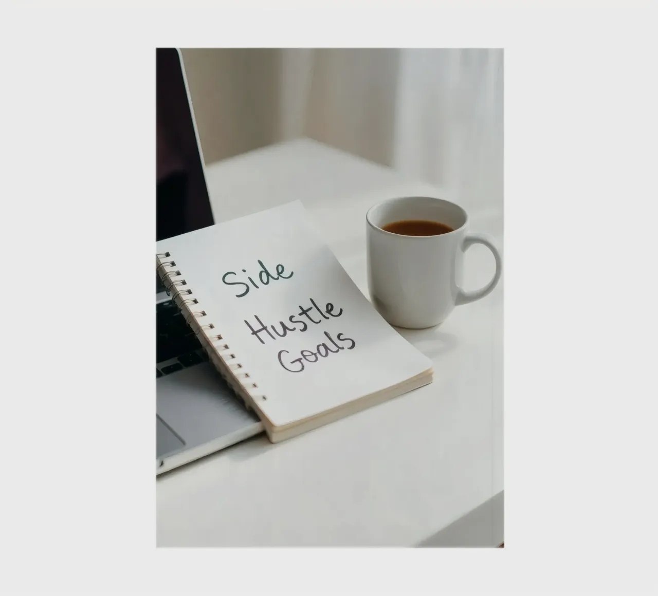Writing side hustle goals while enjoying coffee notebook by DesignDoodle